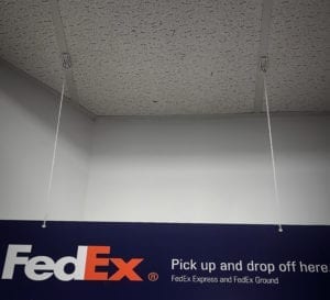 Signs hanging from office drop ceiling